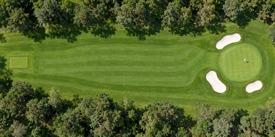 Aerial view of hole 4, Birch Hollow, from the tee on the left to the green on the right.