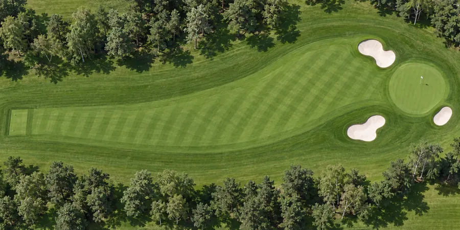 Aerial view of hole 5, The Ridge, from the tee on the left to the green on the right.