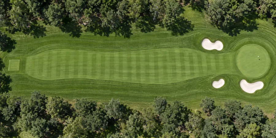 Aerial view of hole 6, Cutty, from the tee on the left to the green on the right.