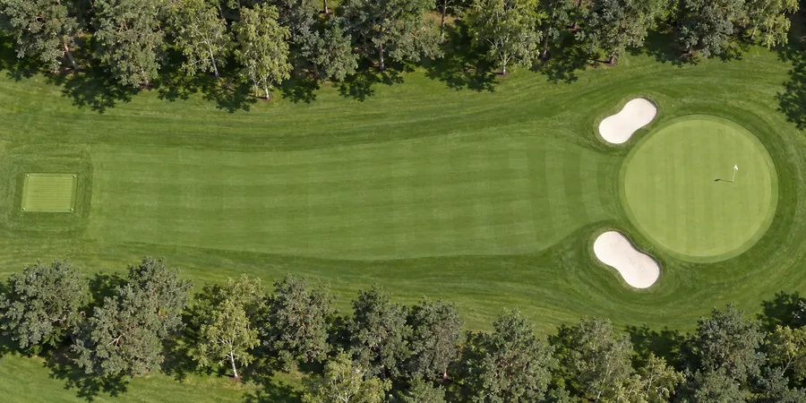 Aerial view of hole 7, The Kettle, from the tee on the left to the green on the right.