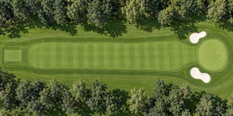 Aerial view of hole 9, Homeward, from the tee on the left to the green on the right.