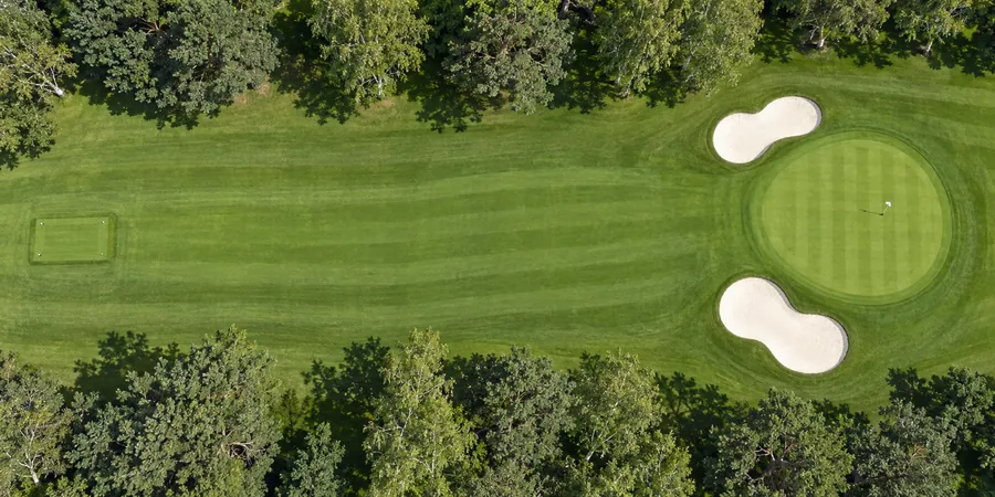 Aerial view of hole 12, Sandy Lane, from the tee on the left to the green on the right.