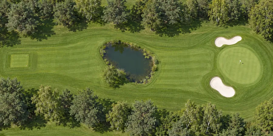 Aerial view of hole 16, Heron, from the tee on the left to the green on the right.