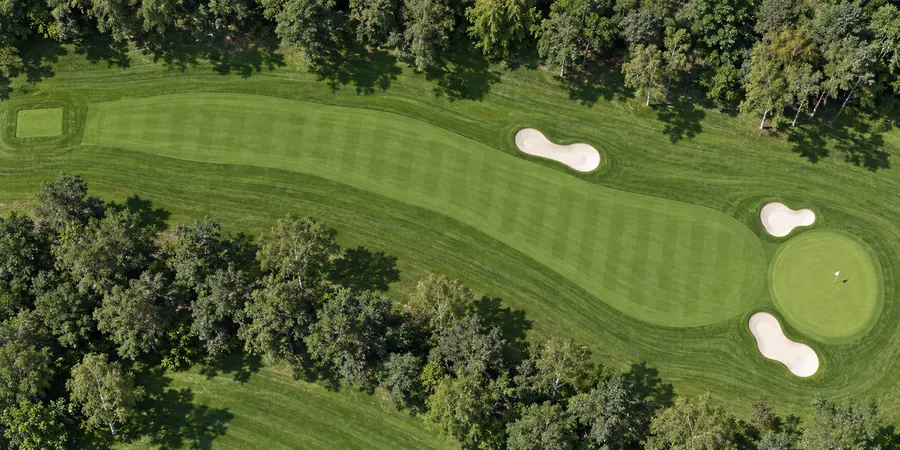 Aerial view of hole 17, Long Drag, from the tee on the left to the green on the right.
